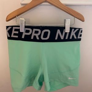 mint green nike pros (size small)